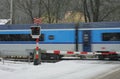 Czech railway crossing at winter with train in a snowstorm Royalty Free Stock Photo