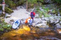 20.04.2019.Czech Republic. A man and a woman rest on the shore next to a canoe. Rest on the river with a canoe. River sport canoe