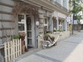 Czech Republic, Prague, Karlin, May 11, 2018: florist shop window, entrance decorated with dry birch tree branches flower pots na