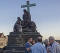 Czech Republic, Prague , September 8, 2018: Family takeing photo in front of Statue of Pieta in the Charles Bridge The