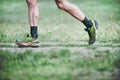 CZECH REPUBLIC, SLAPY, October 2018: Trail Maniacs Run Competition. Legs of the Runner in Green Salomon Running Shoes.