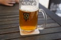 Czech-style Pilsner lager golden beer on table of bar pub restaurant in Prague, Czech Republic