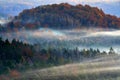 Czech typical autumn landscape. Hills and forest with foggy morning. Morning fall valley of Bohemian Switzerland park, Ceske Royalty Free Stock Photo