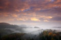 Czech typical autumn landscape. Hills and forest with foggy morning. Morning fall valley of Bohemian Switzerland park. Hills with Royalty Free Stock Photo