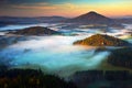 Czech typical autumn landscape. Hills and villages with foggy morning. Morning fall valley of Bohemian Switzerland park. Hills wit Royalty Free Stock Photo
