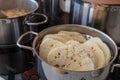 Czech yeast dumpling sliced into wheels and put into a steaming pot to keep the dumpling hot