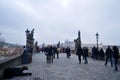 Czechia people and foreign travelers walking travel visit ancient antique building Charles Bridge crossing Vltava river in winter