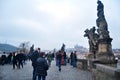 Czechia people and foreign travelers walking travel visit ancient antique building Charles Bridge crossing Vltava river in winter