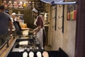 Czechia people making and grilling bread prague style called Trdelnik