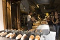 Czechia people making and grilling bread prague style called Trdelnik for sale