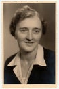 Vintage photo shows woman. Black and white studio portrait.