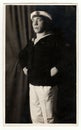 Vintage portrait photo shows young man in a marine costum. Photo studio portrait, circa 1930s