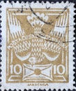 Czechoslovakia Circa 1920: A postage stamp printed in Czechoslovakia showing a graphic representation of a pigeon with a letter