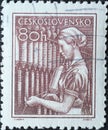 Czechoslovakia Circa 1954: A postage stamp printed in Czechoslovakia showing a portrait of a textile worker at a spinning machine