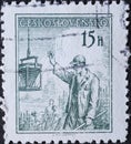 Czechoslovakia Circa 1954: A postage stamp printed in Czechoslovakia showing a portrait of a construction worker pouring concrete