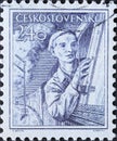 Czechoslovakia Circa 1954: A postage stamp printed in Czechoslovakia showing a portrait of an engine driver while driving