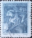 Czechoslovakia Circa 1954: A postage stamp printed in Czechoslovakia showing a portrait of a foundry worker starting the blast fur