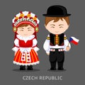 Czechs in national dress with a flag.