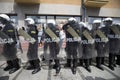 Polish policemen in action, white helmets, plastic covers