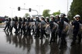 Polish policemen in action, white helmets, plastic covers