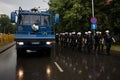 Polish policemen in action, white helmets, plastic covers