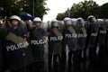 Polish policemen in action, white helmets, plastic covers