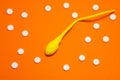 3D anatomical model of sperm cell or spermatozoon is on orange background surrounded by white pills ornament polka dots. Photo con