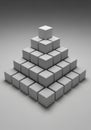 A 3D arrangement of gray cubes forms a pyramid structure on a Royalty Free Stock Photo