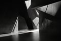 A 3D black interior with sharp, angular forms and a matte finish. The deep shadows and geometric