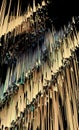 3D blue and beige curtain of melting wax on a black background