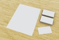 3d Business cards and blank notepads on wooden table.