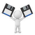 3D Character holding up two floppy disks Royalty Free Stock Photo