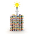 3D Character Standing on Many Colorful Books has Light Bulb Idea Royalty Free Stock Photo