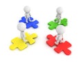 3D Characters standing on different colored puzzle pieces Royalty Free Stock Photo