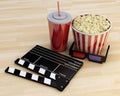 3d Cinema clapper board, popcorn and drink. Royalty Free Stock Photo