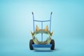 3d close-up rendering of big golden crown on blue hand truck on light-blue background.