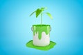 3d close-up rendering of bucket of green paint standing in puddle of spilt paint with young green sprout growing right