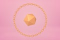 3d close-up rendering of gold icosahedron encircled with gold chain bracelet floating on yogurt pink background.