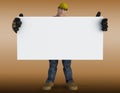 Construction worker holding a white sign board - brown background Royalty Free Stock Photo