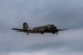 D-Day Squadron C-47 drop ship in Houston against a clouded sky