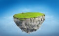 3D fantasy floating island with green grass land on blue sky Royalty Free Stock Photo