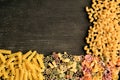 DÃâfferent types of raw  pasta on a wooden table Royalty Free Stock Photo