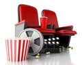 3d Film reel, popcorn and Cinema clapper board on theater seat. Royalty Free Stock Photo