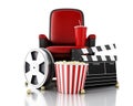 3d Film reel, popcorn and drink on theater seat. Royalty Free Stock Photo