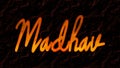 3D fire text effect of Hindi name Madhav on dark background. Royalty Free Stock Photo