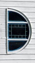 D is Formed By Arched Window on Old White Barn Royalty Free Stock Photo