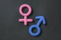 3d gender symbol pink and blue icon on black background. Concept of equality of man and woman,.differences between the sexes,