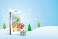 3D gift boxes in smart phone with winter snowflakes falling background. Idea for season greetings in Christmas and new year Royalty Free Stock Photo