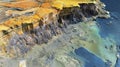 3D GIS aerial visualization of a coastal cliff highlighting elevation erosion patterns and geological features.
