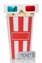 3D glasses and box filled with popcorn, movie ticket on white. Royalty Free Stock Photo